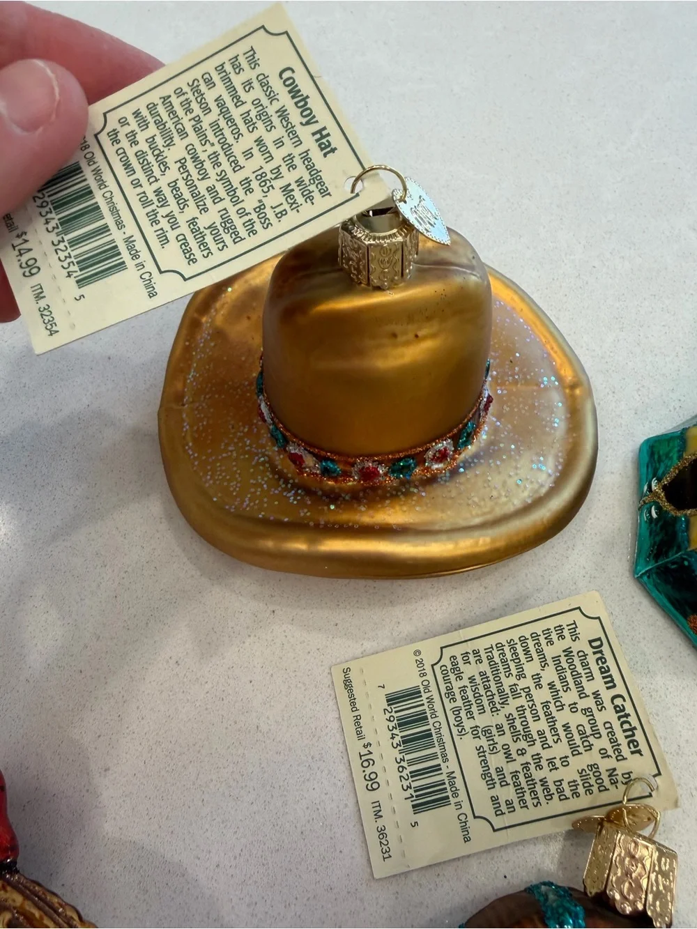 Lot of old world Christmas ornaments cowboy themed